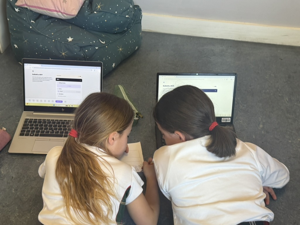 Two pupils working together on Norhi during a lesson